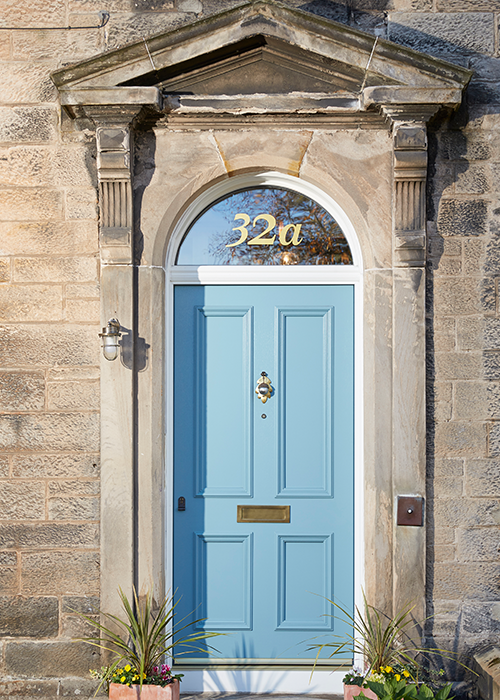 Traditional blue bespoke external door of property